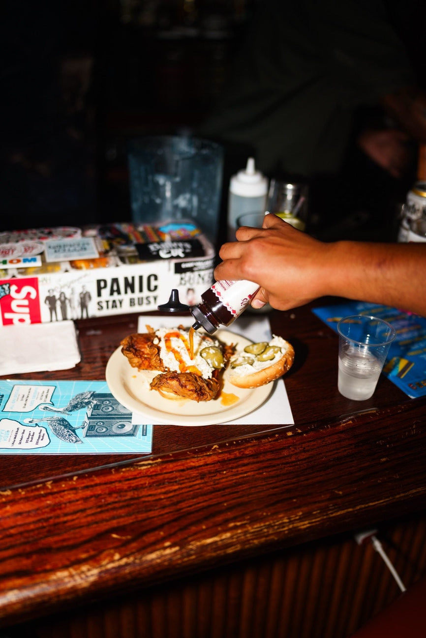 Food served at the first B-EATS in New York City, drizzled with Mike's Hot Honey