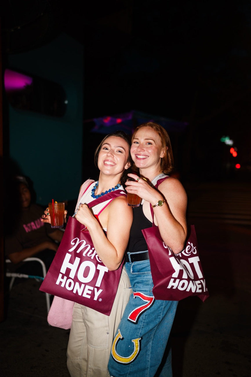 A guest at the first B-EATS in New York City wearing Mike's Hot Honey merchandise