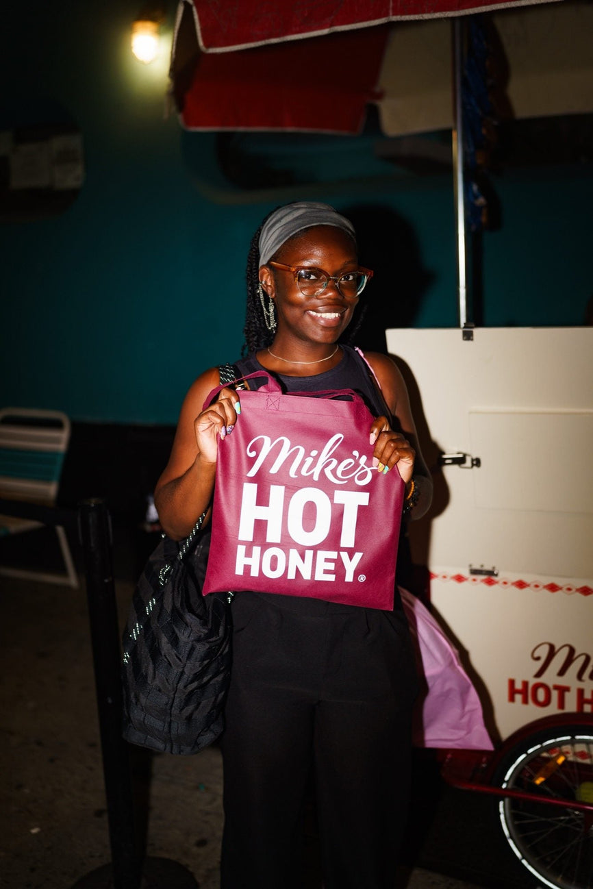 A guest at the first B-EATS in New York City wearing Mike's Hot Honey merchandise