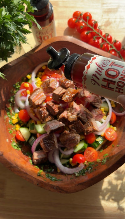 Steak salad drizzled with Mike's Hot Honey